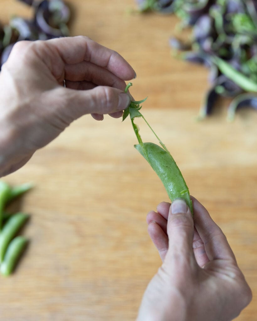 How to remove the strings from a snap pea.