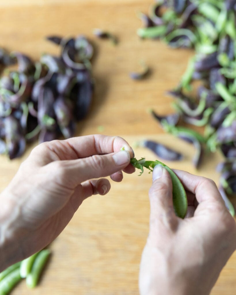 How to remove the top of a snap pea.