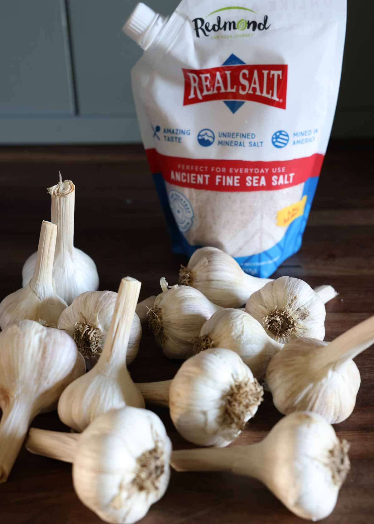 A bag of redmonds real salt and garlic bulbs