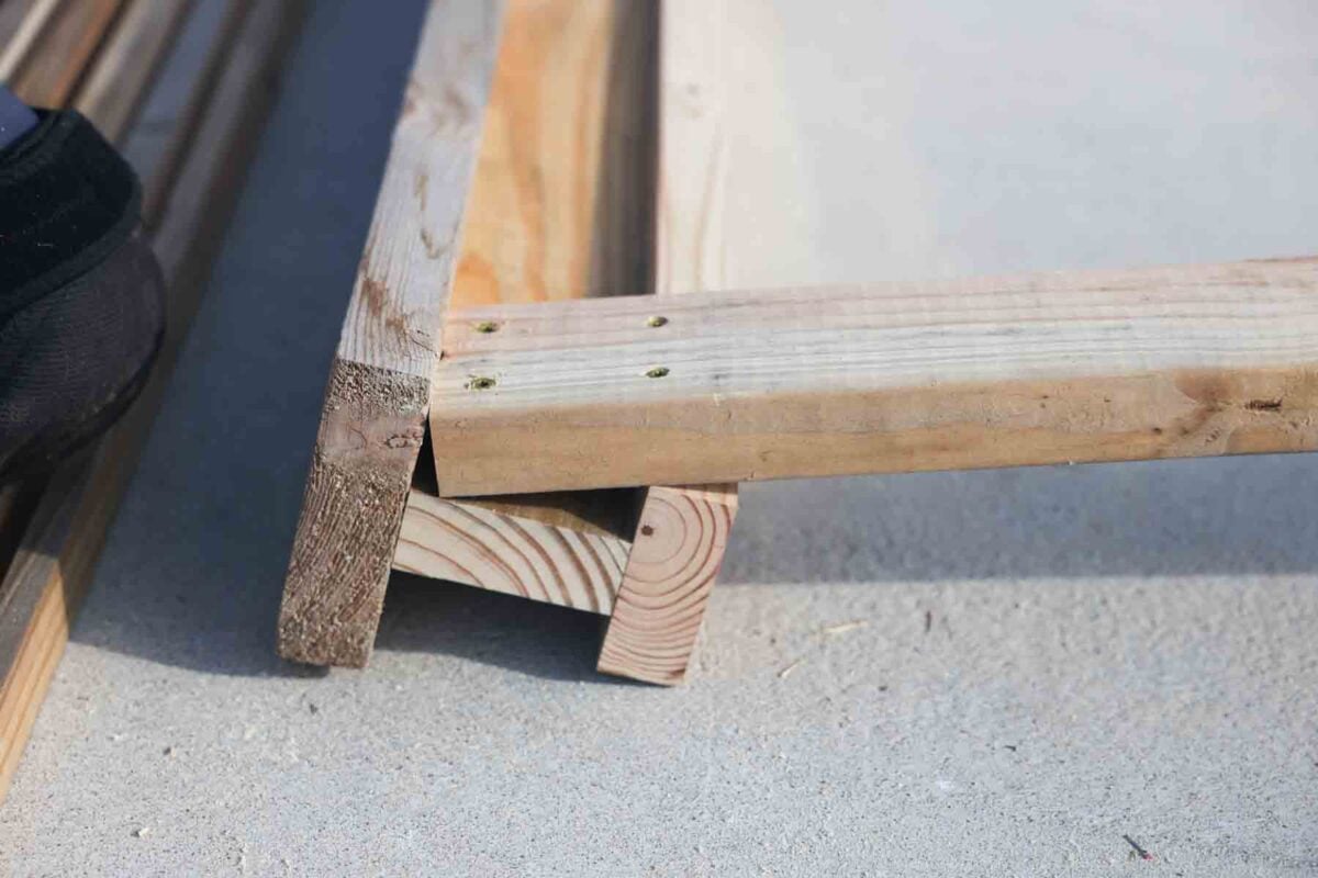 screwing the second leg onto the sawhorse
