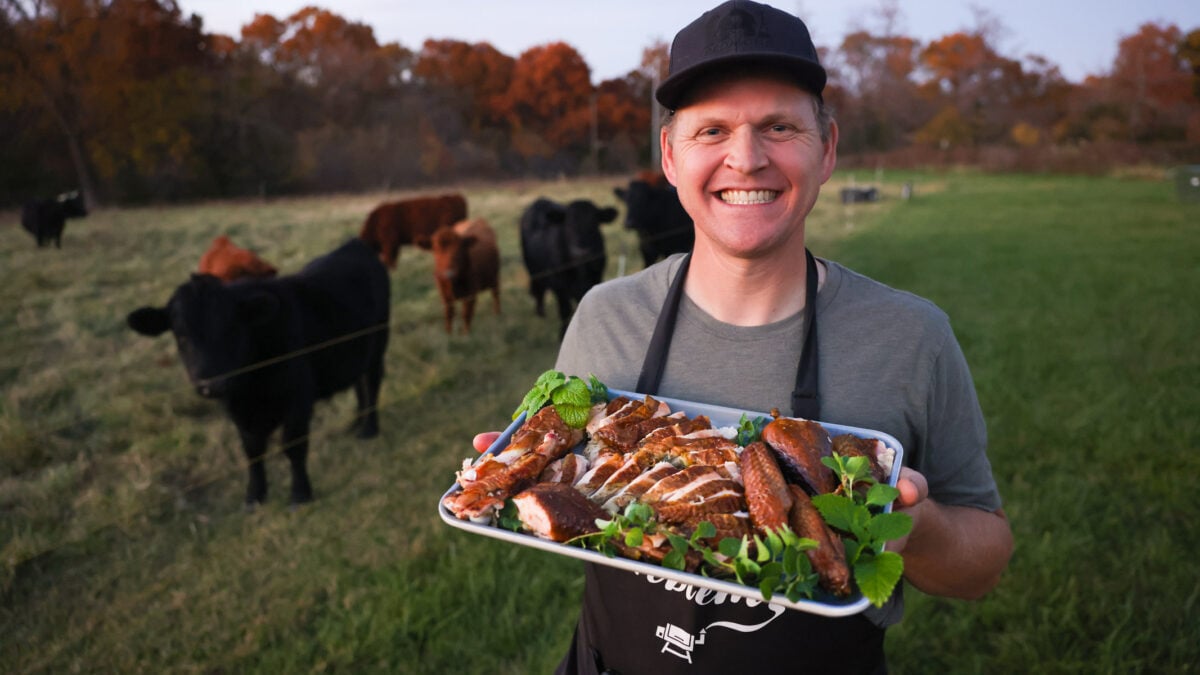 Me holding a carved smoked turkey.