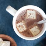 An overhead view of homemade hot cocoa mix with homemade marshmallows.