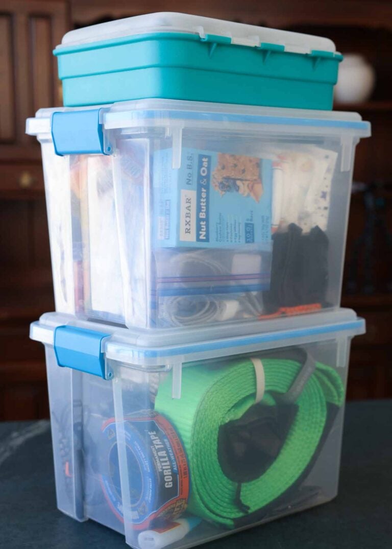 A winter emergency car kit in storage containers.