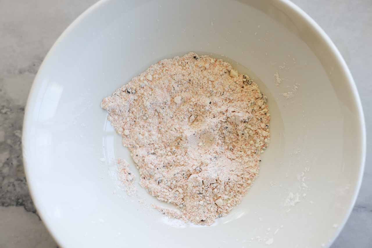 Dry seasoning mix for sweet potato fries is mixed together in a bowl.