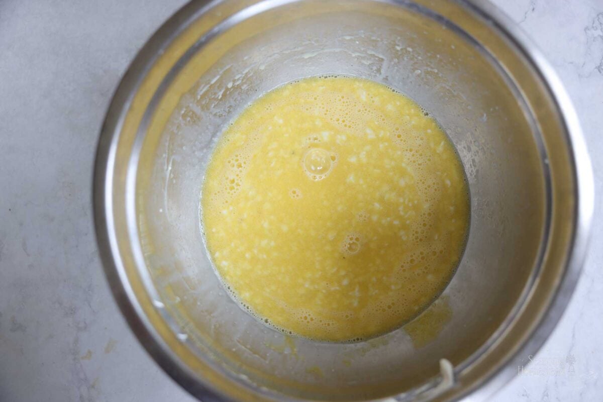 Wet ingredients for the pancakes are mixed together in the bowl.