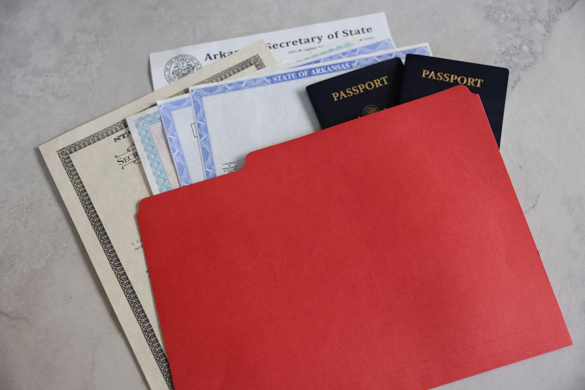 A red folder shows important documents that are needed for identification in an emergency.