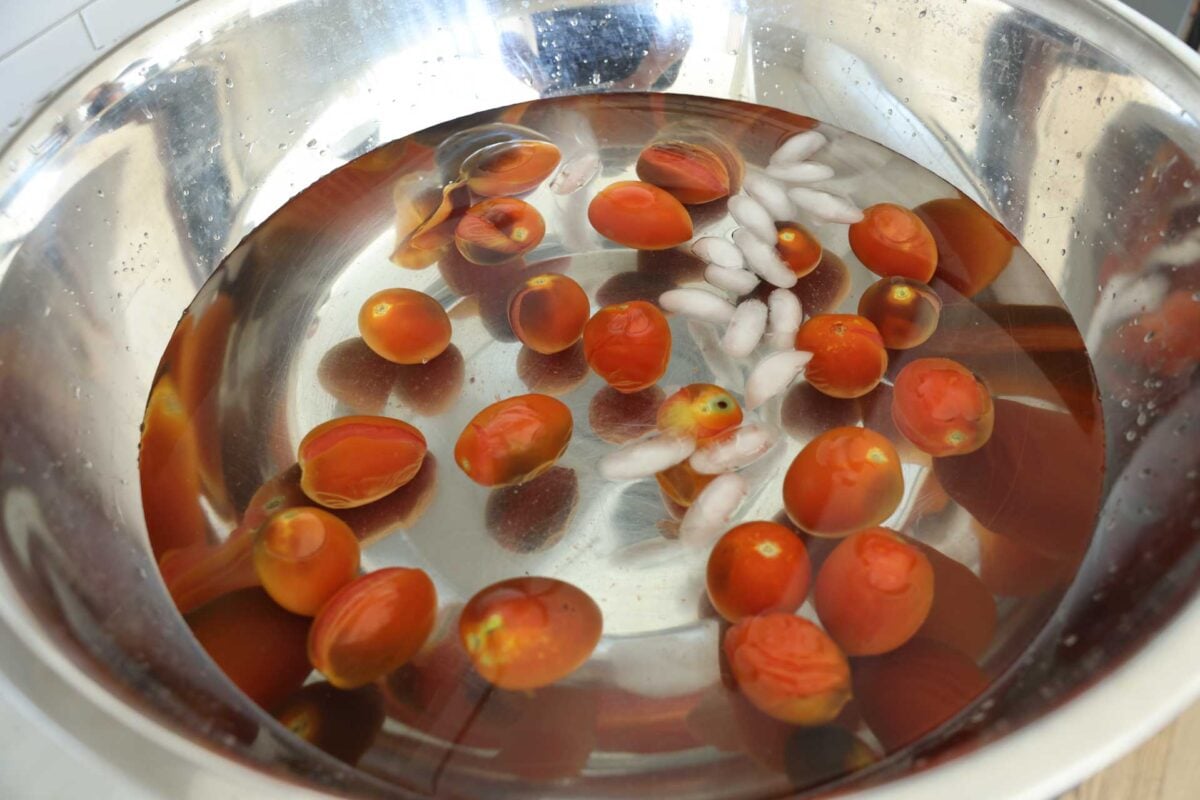 Tomatoes in the ice water bath.
