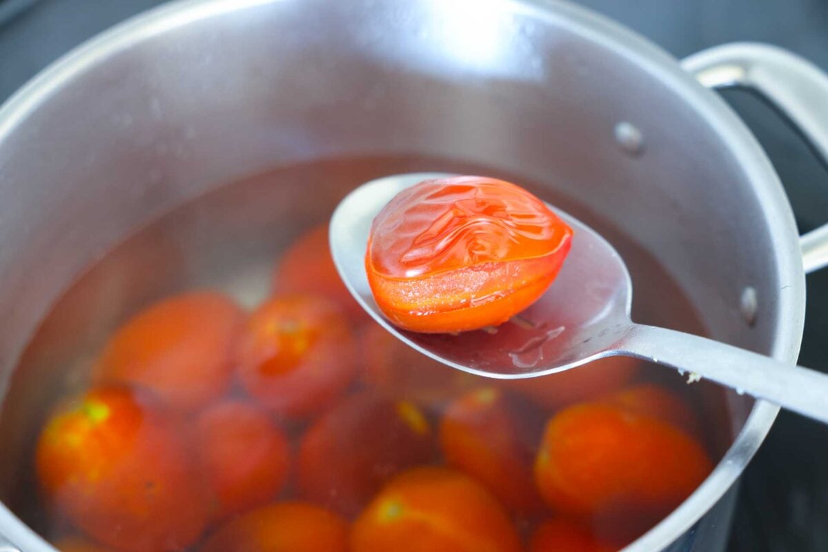 A tomato with the skin split so it's easy to peel.