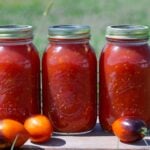 finished jars of tomatoes after canning.